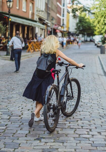 young-sports-woman-bicycle-european-city-sports-urban-environments